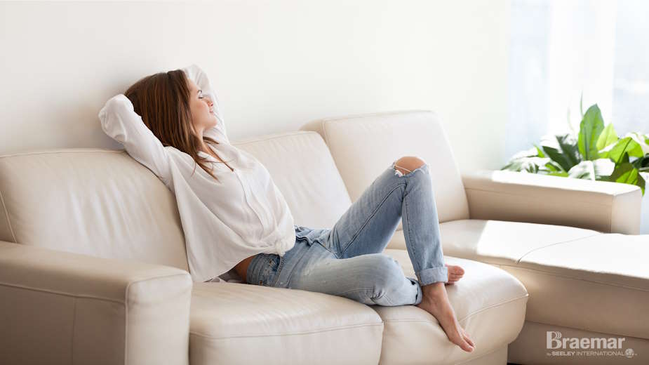 A woman sitting on the sofa.