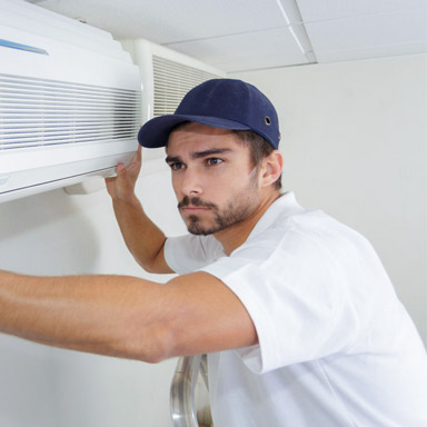 A man fixing an air-condition.