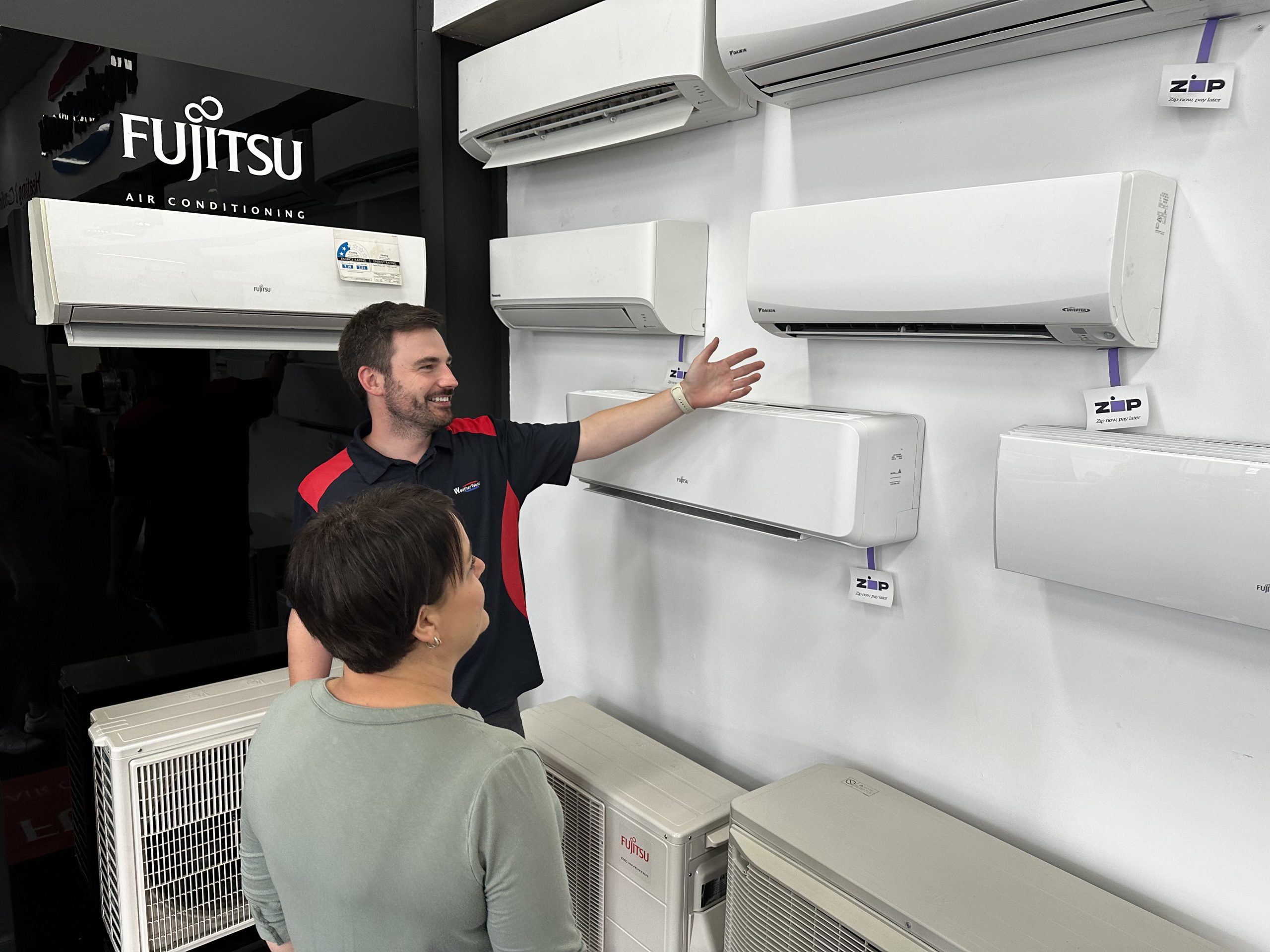 A man selling Fujitsu Air-Conditioning Units.